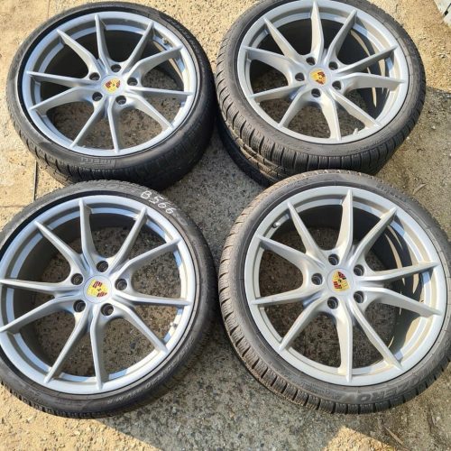 A set of four original 19-inch rims with tires